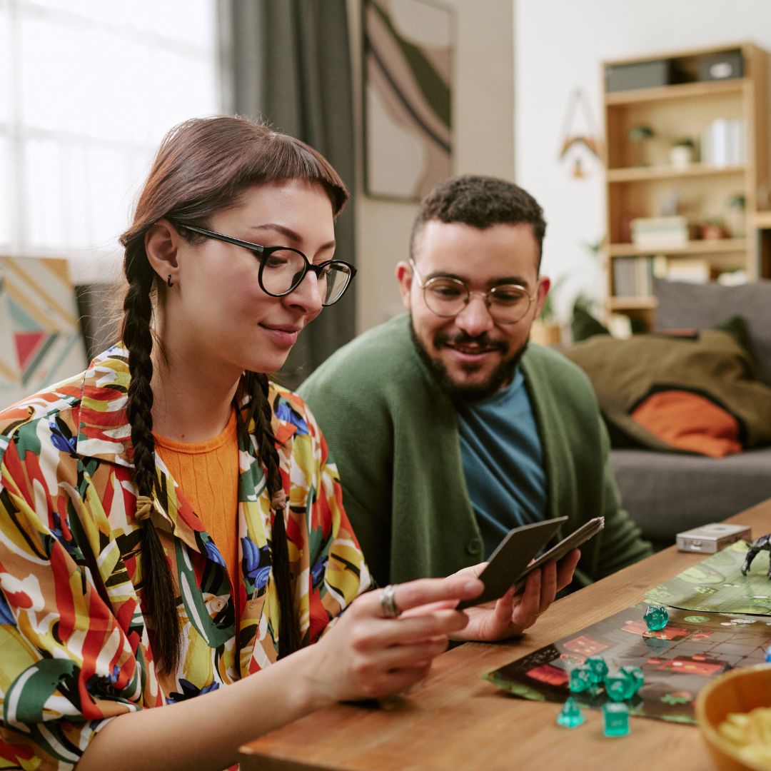 Photo of people playing a board game